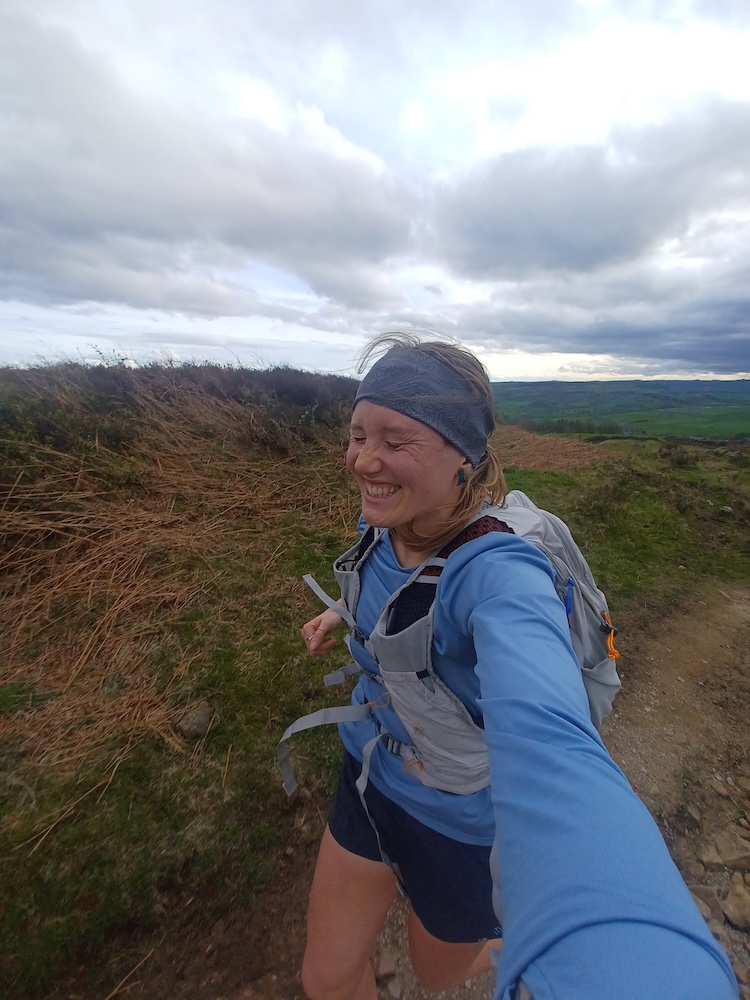 Loz running across the Peak District in her Camelbak Octane 22l
