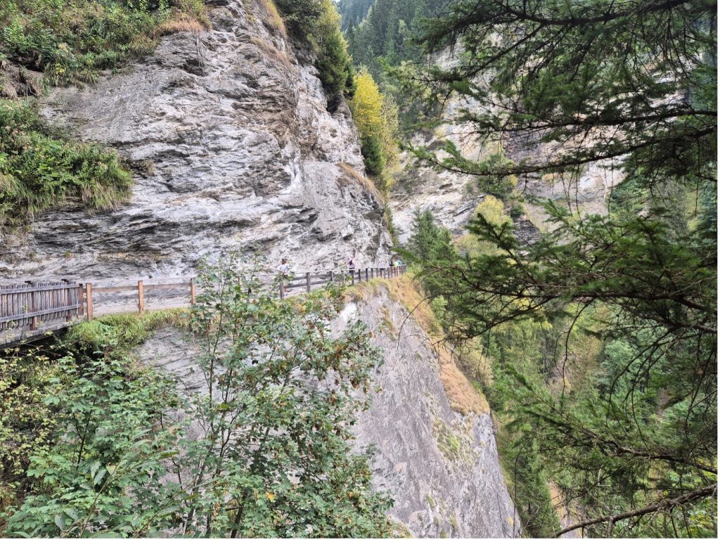 A path running alongside a rocky mountain in the adidas TERREX Infinite Trails in Gastein